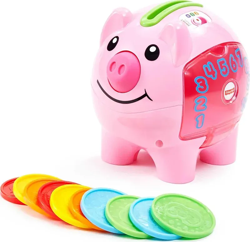 Celengan mainan babi warna pink dengan koin berwarna-warni.
